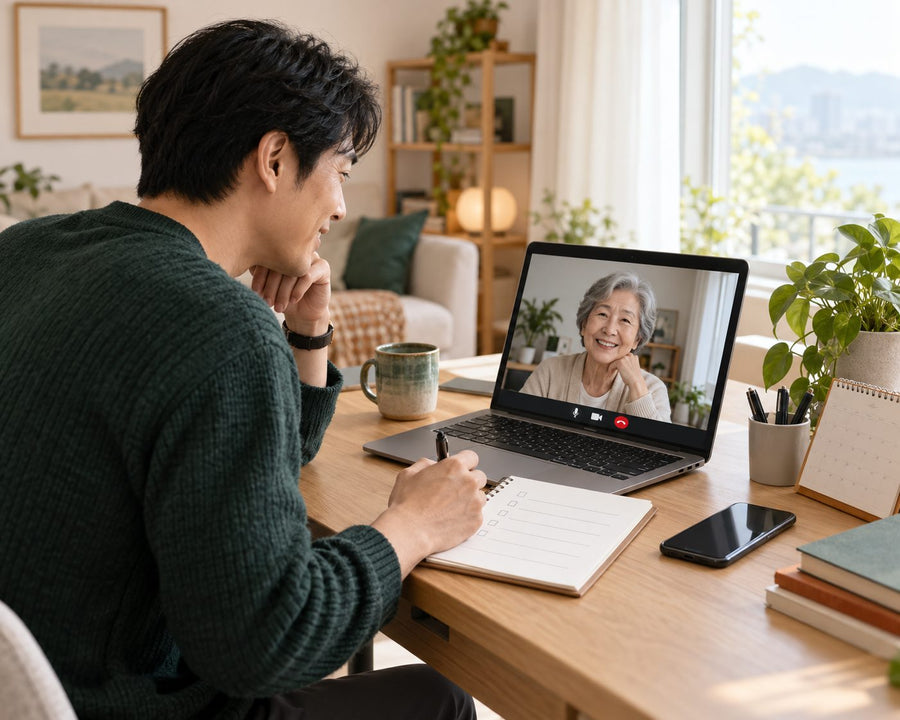 A son abroad on a video call with his mother, writing a checklist