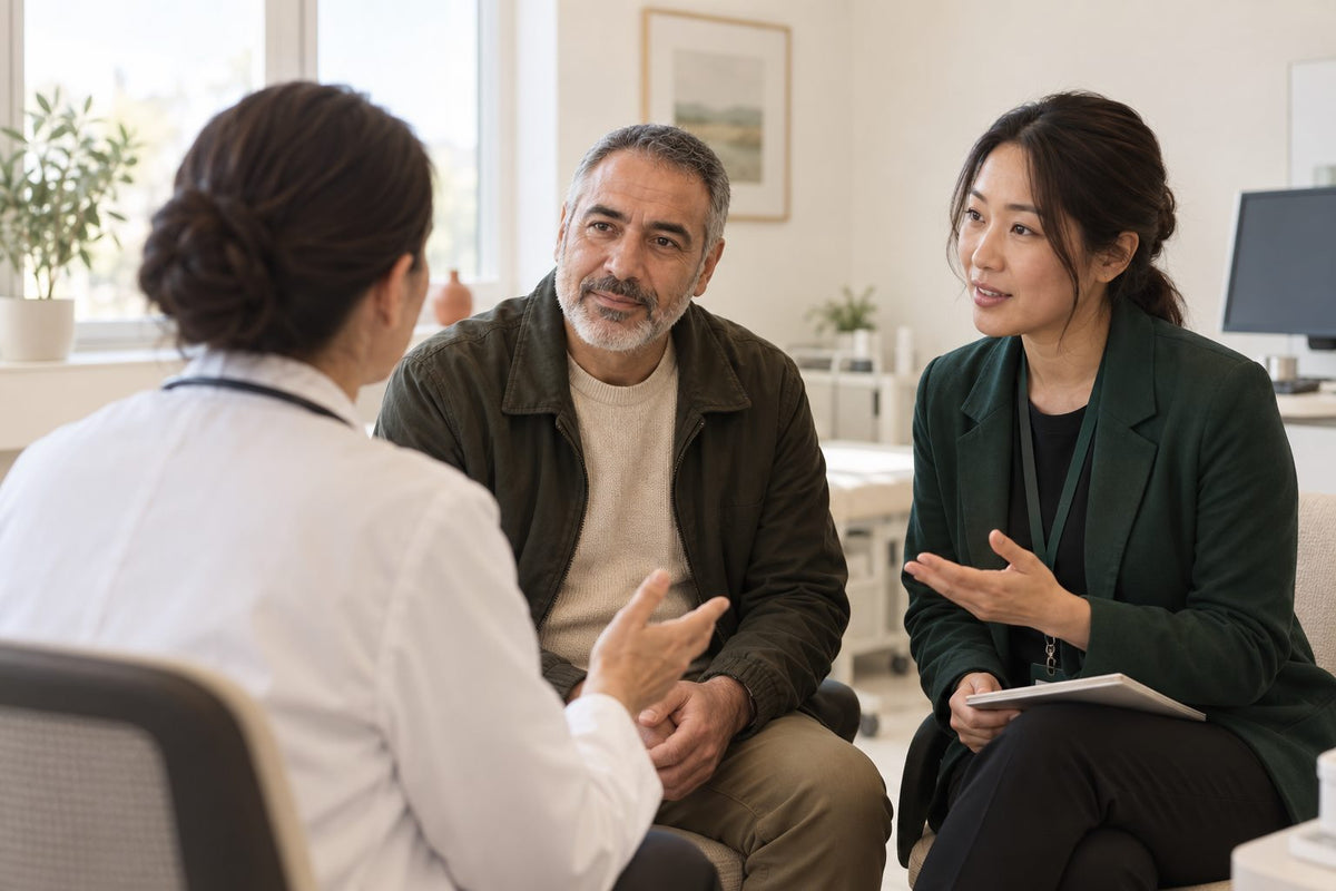 An interpreter with an international patient and his doctor